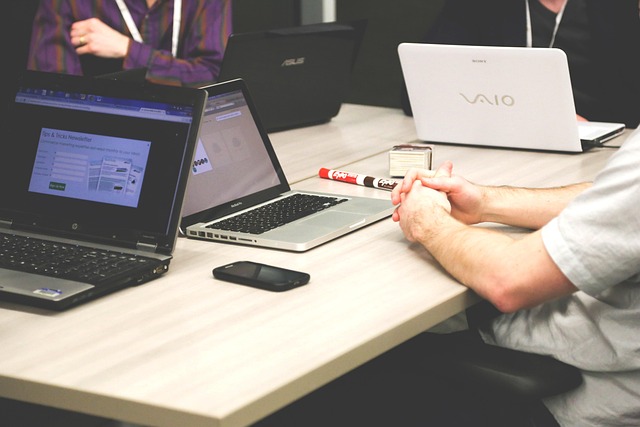 photo of several laptop computers on a desk